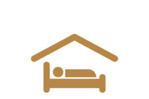person in bed under a roof